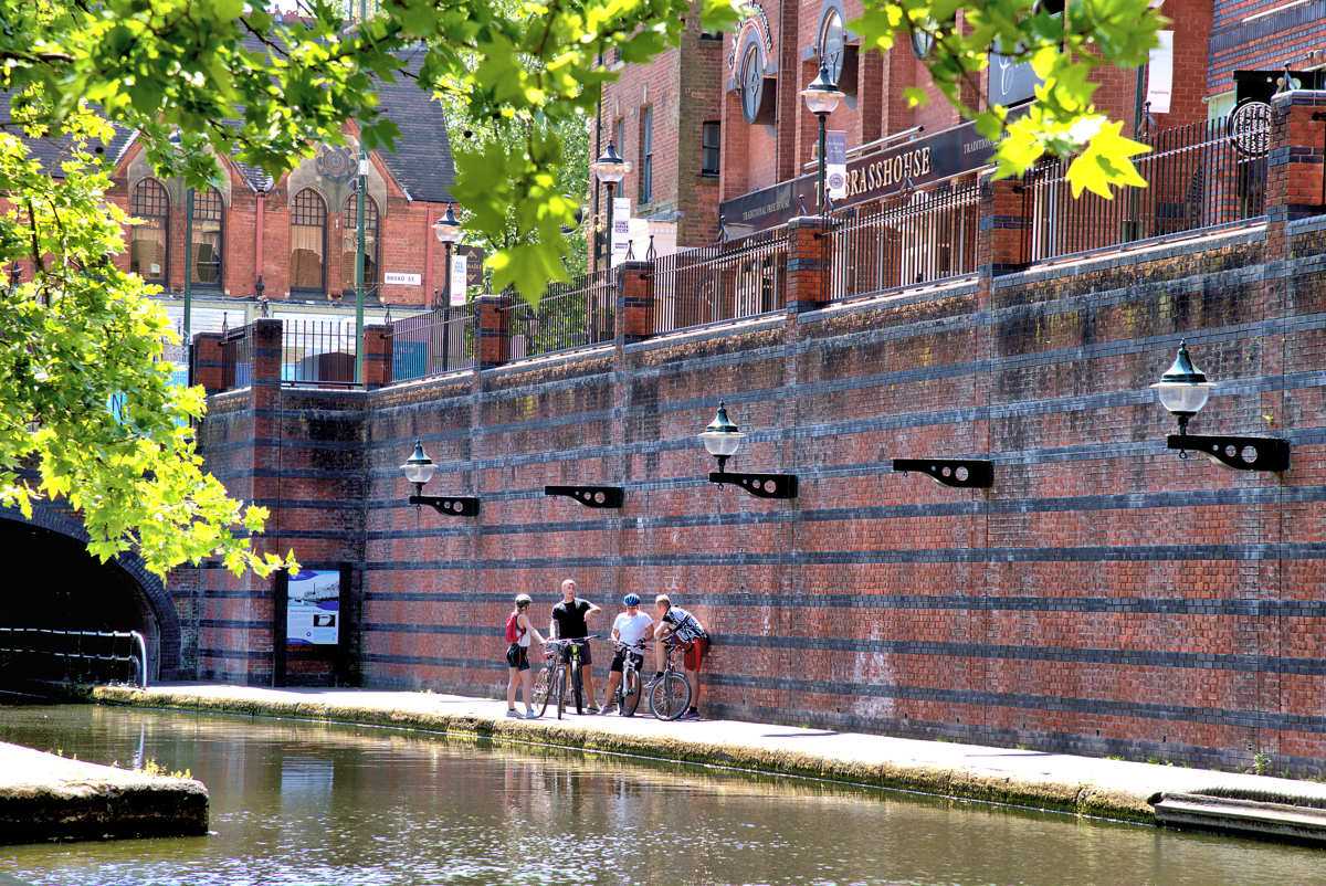 Cycling on the canal towpath at Brindleyplace, Birmingham